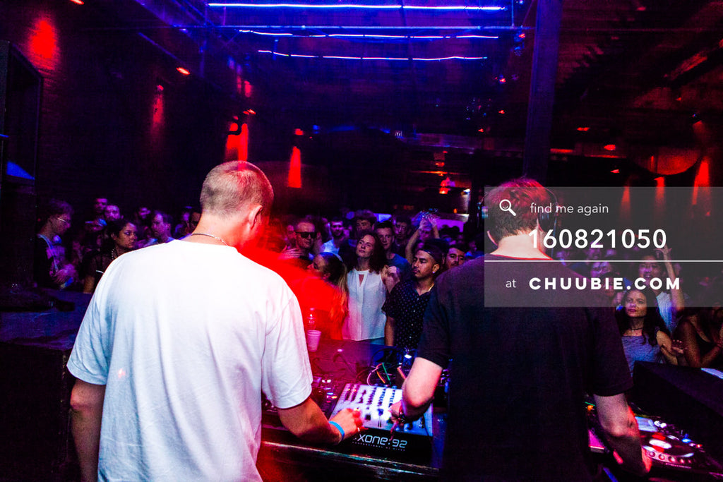 160821050 | 
Joy Orbison B2B Ben UFO (Ben Thomson) behind the decks lit by the glow of the industrial warehou... | Team Chuubie