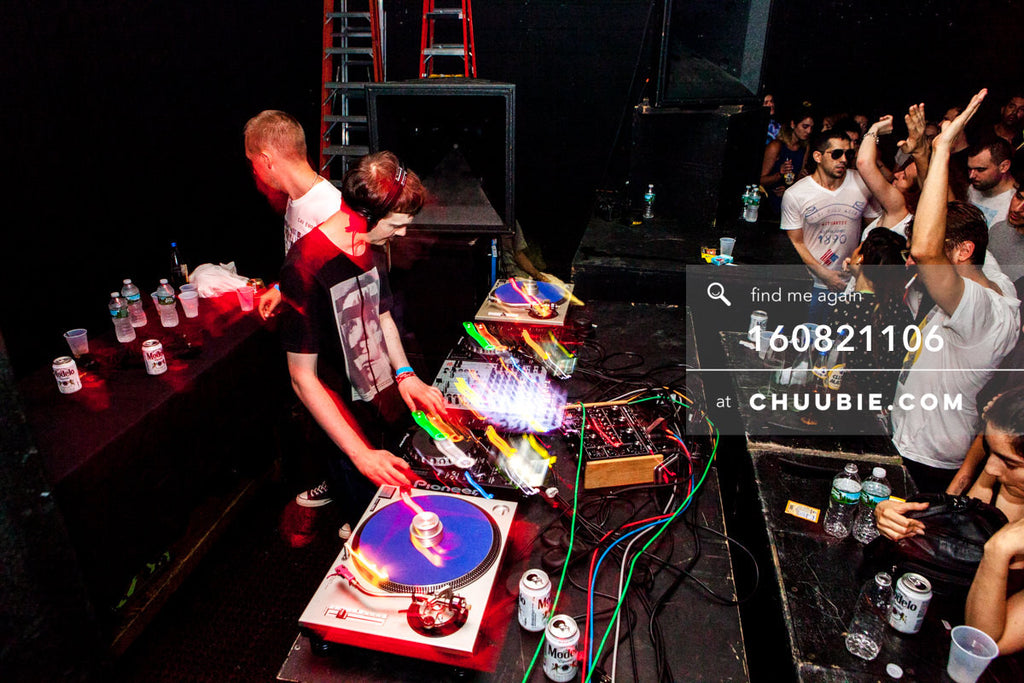 160821106 | 
Side view: Ben UFO (Ben Thomson) & Joy Orbison (Peter O'Grady) DJing side by side with crowd... | Team Chuubie