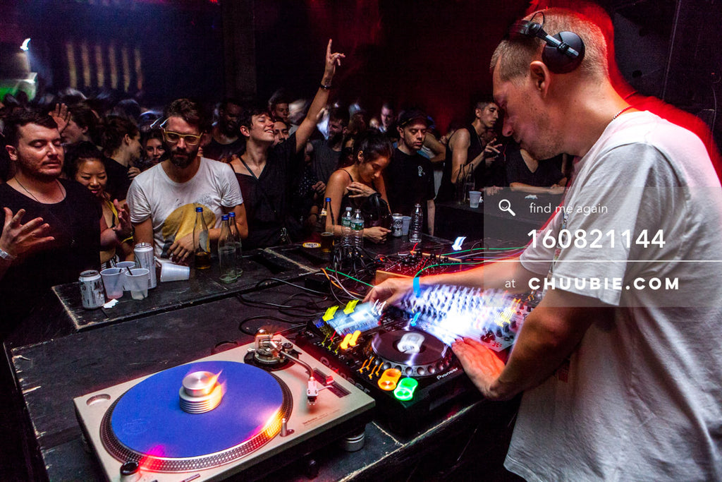 160821144 | 
Joy Orbison (Peter O'Grady) DJing behind the decks and hands raised in the crowd.
Electric Minds... | Team Chuubie