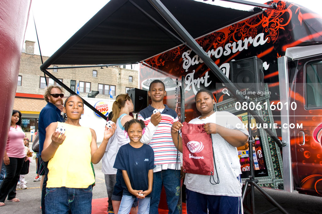 080613010 | 
Local Chicago residents stand in front of the mobile tour van with their prizes.
—Dr. Pepper Sa... | Team Chuubie