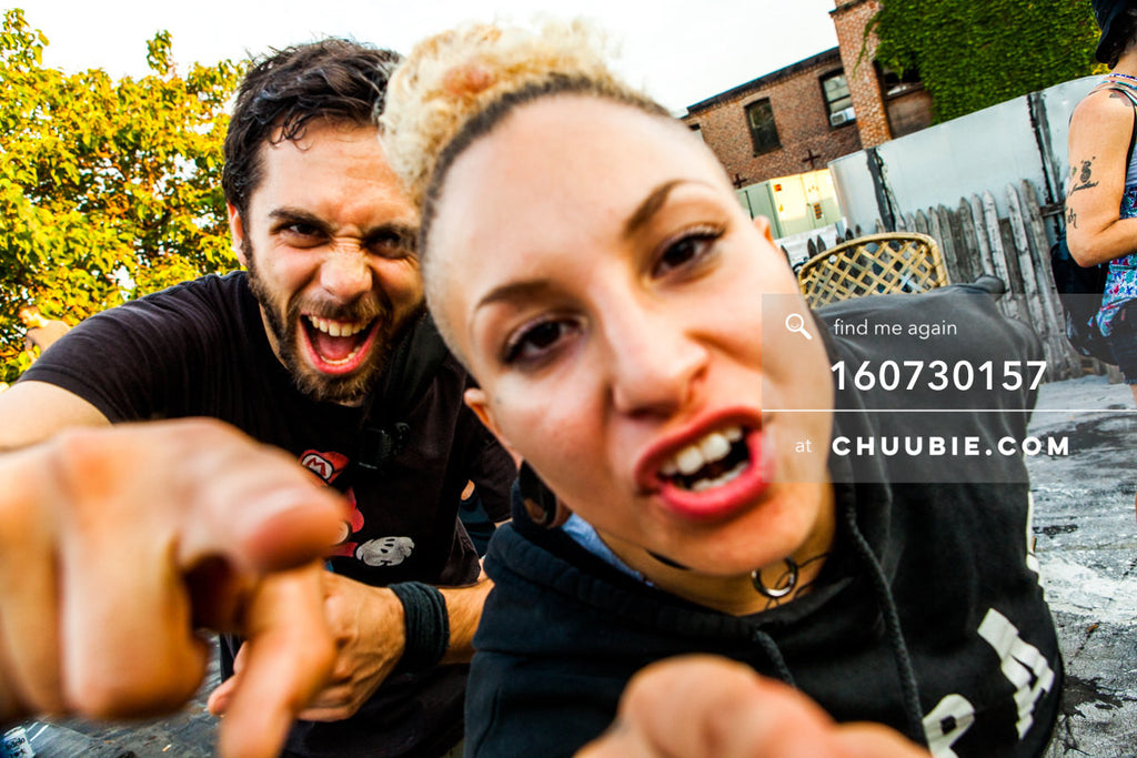 160730157 | Guy and athletic punk girl in cutoff RAMPAGE sportswear sweatshirt serving attitude to camera fin... | Team Chuubie