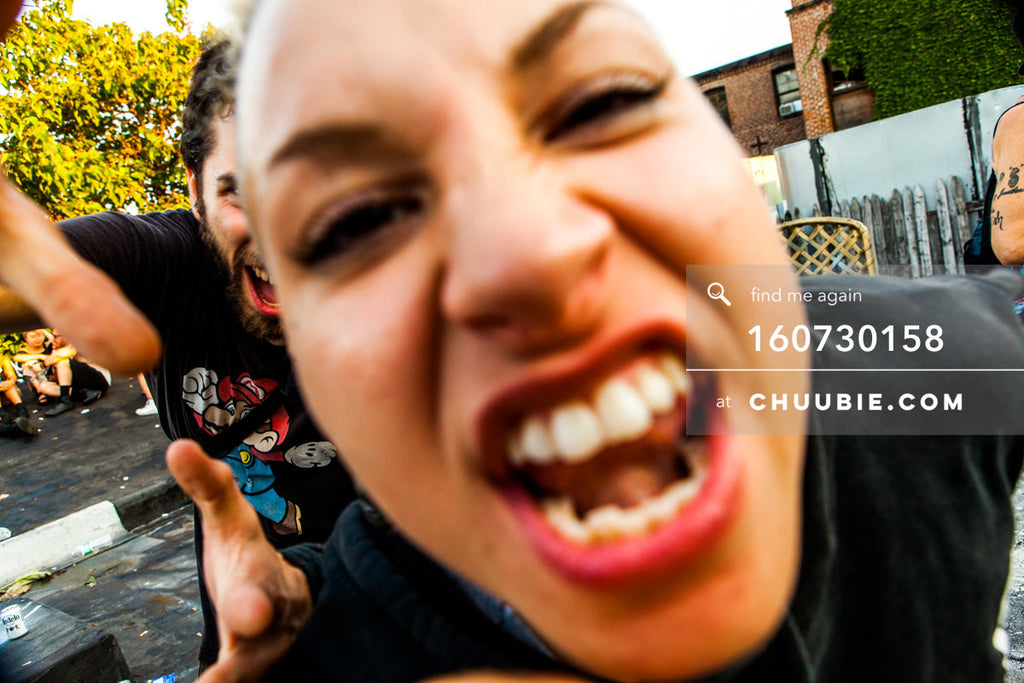 160730158 | Guy and athletic punk girl in cutoff RAMPAGE sportswear sweatshirt serving attitude close up at c... | Team Chuubie