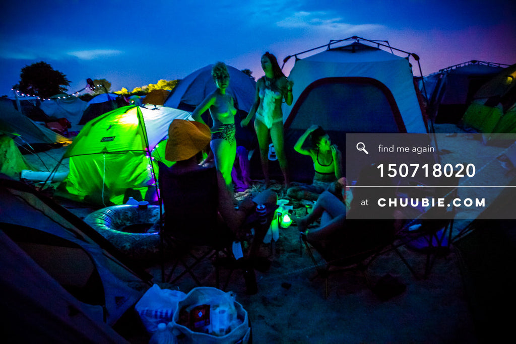 150718020 | 
Vibrant sunset into evening colors with glowing green camping tents.
—Gratitude Migration 2015: ... | Team Chuubie