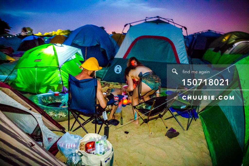 150718021 | 
Campers settle in with vibrant saturated blue-magenta sunset at regional Burning Man festival.
—... | Team Chuubie