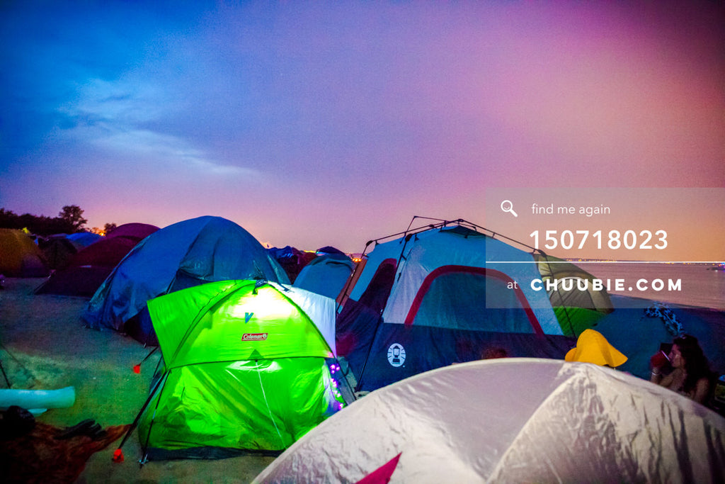 150718023 | 
Scenic landscape of camping tents against magnificent vibrant saturated blue-magenta sunset at r... | Team Chuubie