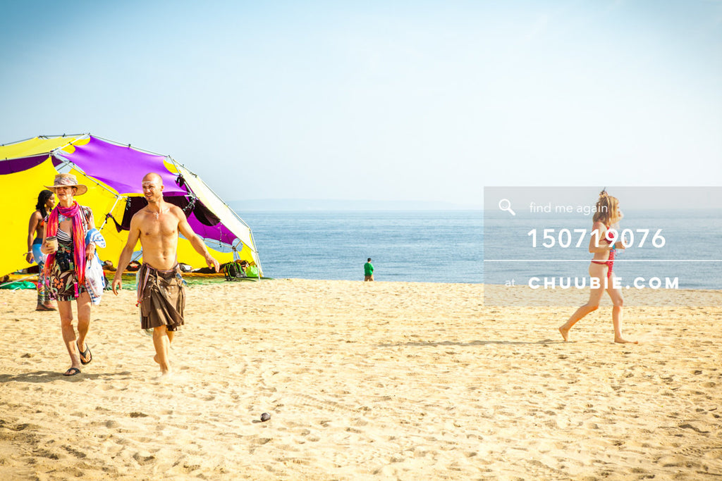 150719076 | 
Ryan walks with other burners along playa beach.
—Gratitude Migration 2015: Summer Dream. Mornin... | Team Chuubie