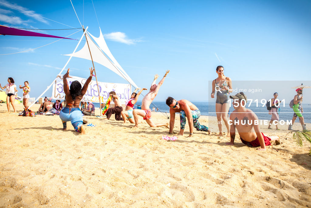 150719101 | 
Crescent moon pose at group beach yoga sessions!
—Gratitude Migration 2015: Summer Dream. Mornin... | Team Chuubie