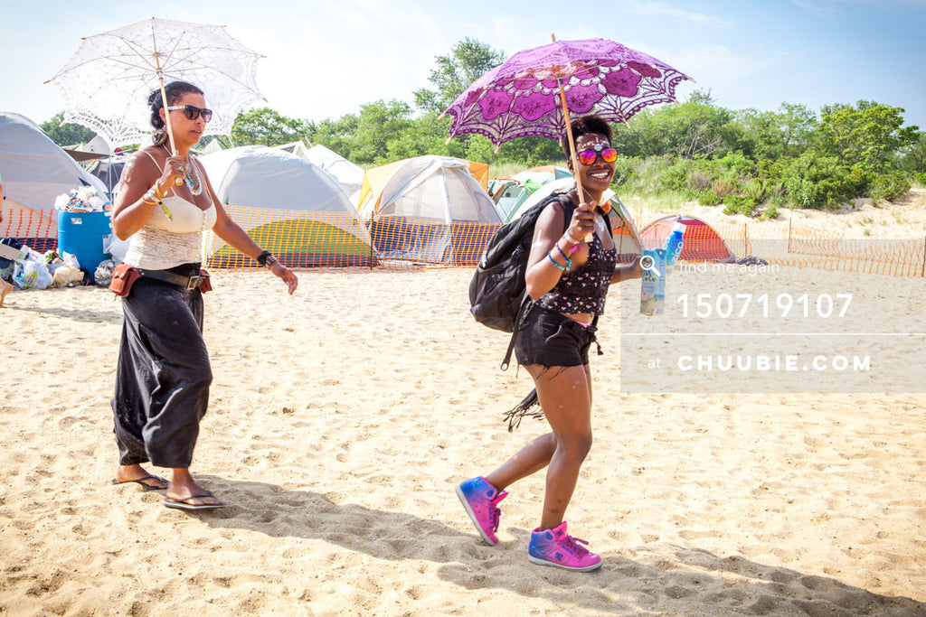 150719107 | 
DJ REsy walking to the art car stage to play her set.
—Gratitude Migration 2015: Summer Dream. M... | Team Chuubie