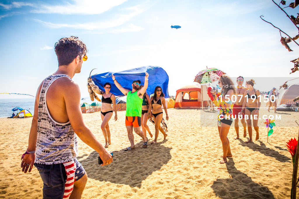 150719150 | 
Nothing like a beach sunshield caravan on a blazing hot day.
—Gratitude Migration 2015: Summer D... | Team Chuubie