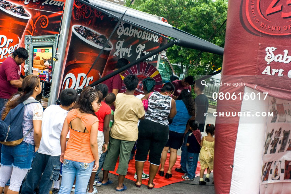 80613017 | 
Families line up to spin the prize wheel.

—Dr. Pepper Sabrosura mobile tour event photography. ... | Team Chuubie