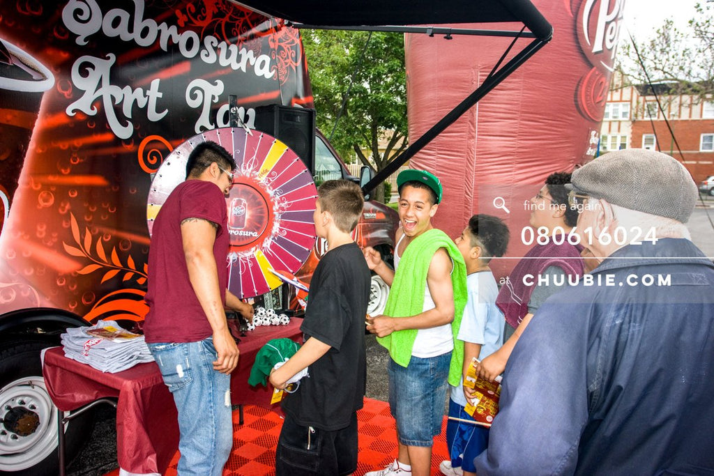 80613024 | 
Young teen boys spinning the prize wheel.

—Dr. Pepper Sabrosura mobile tour event photography. ... | Team Chuubie