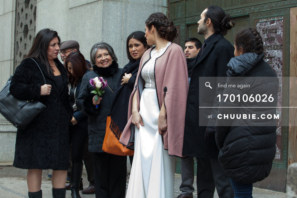 170106026 | Cinematic shot of Bride & Groom standing with families bundled in winter coats outside NYC Ci... | Team Chuubie