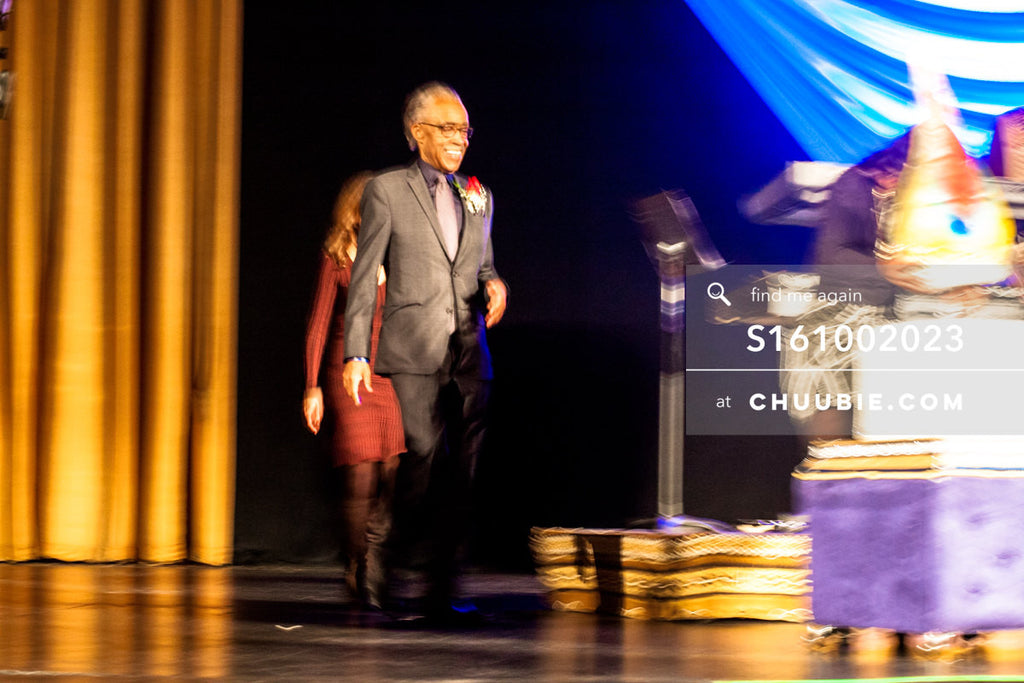 S161002023 | Reverend Al Sharpton walking on stage toward large cake, slight motion blur; photographed in New ... | Team Chuubie