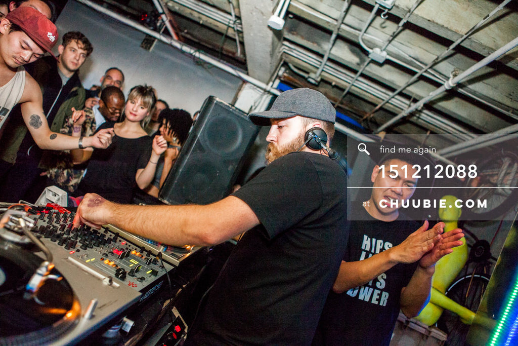 151212088 | 
DJ Sevron (Hugo Ball / SmartBar) spinning vinyl, Mike Servito clapping  at Brooklyn warehouse.
—... | Team Chuubie