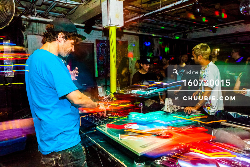 160730015 | DJ Donny Burlin behind the DJ decks with light trails.
— Sublimate & Ruse Labs present: Mood ... | Team Chuubie