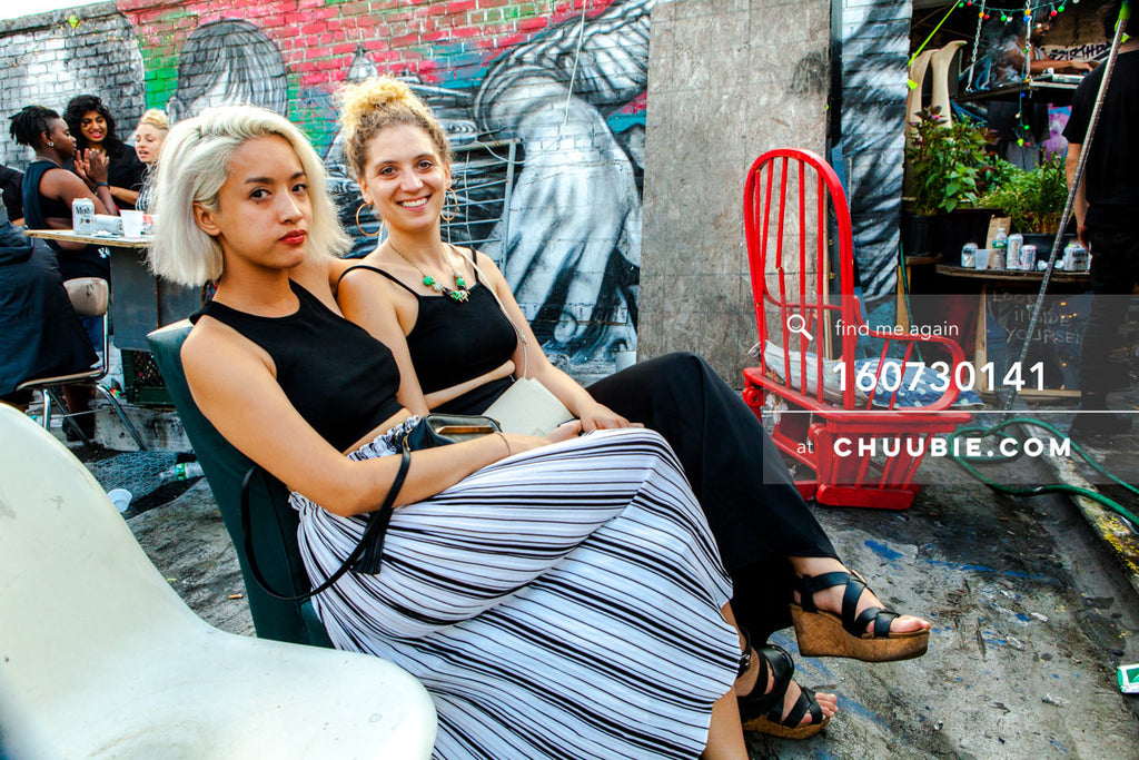 160730141 | Two stylish elegant girls, blond hair, with graffiti wall on Brooklyn summer rooftop.
— Sublimate... | Team Chuubie